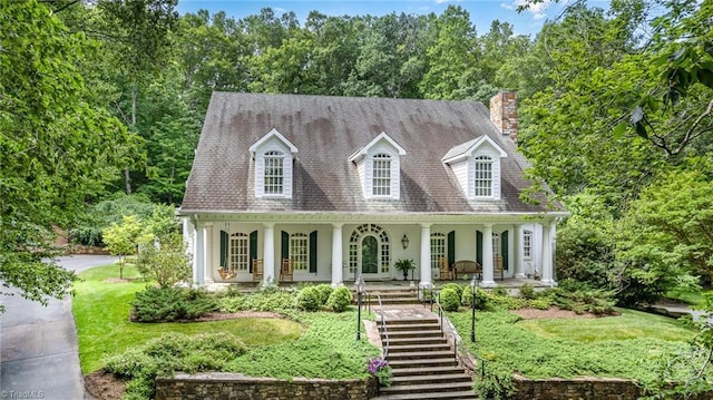 4432 Bent Tree Farm Rd, Winston-Salem, NC 27104 - cape cod home featuring a chimney, a porch, stairway, and stucco siding