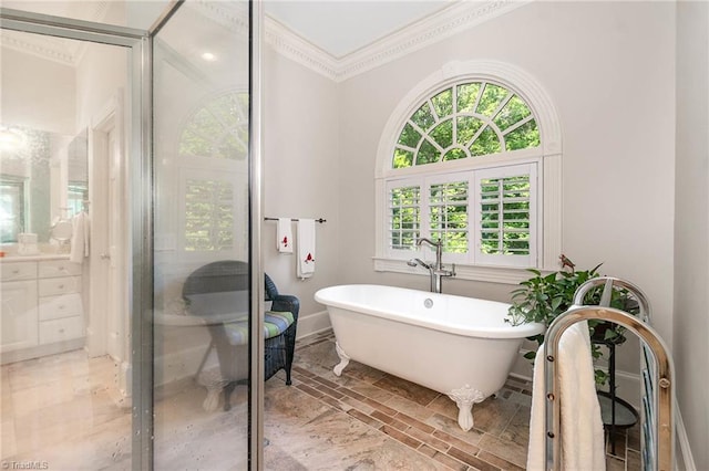 4432 Bent Tree Farm Rd, Winston-Salem, NC 27104 - bathroom featuring ornamental molding, plenty of natural light, vanity, a soaking tub, and marble finish flooring