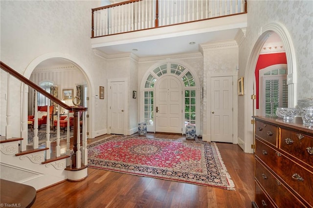 4432 Bent Tree Farm Rd, Winston-Salem, NC 27104 - foyer entrance with a high ceiling, stairs, wood finished floors, arched walkways, and crown molding