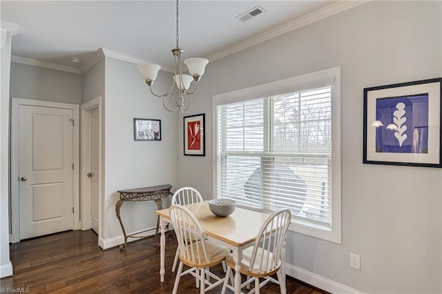 dining area with plenty of natural light, visible vents, dark wood finished floors, and crown molding