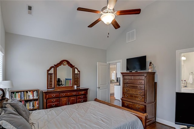 bedroom with a ceiling fan, visible vents, connected bathroom, and high vaulted ceiling