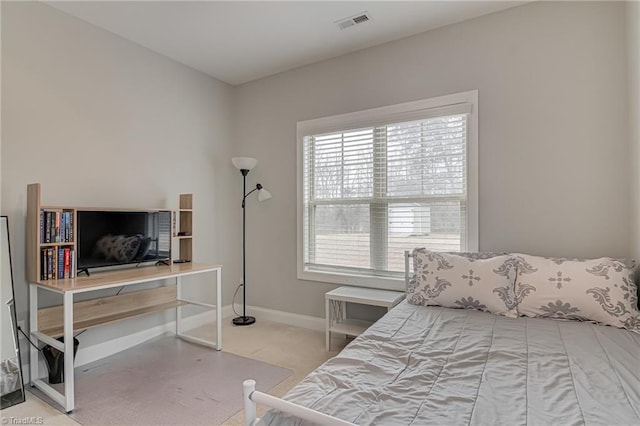 bedroom with visible vents, baseboards, and carpet flooring