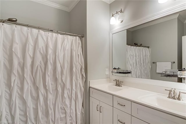 bathroom featuring double vanity, ornamental molding, and a sink