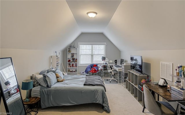 carpeted bedroom with vaulted ceiling