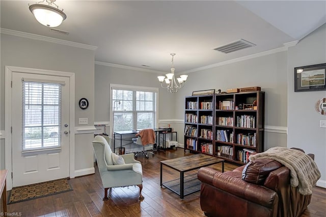 living area featuring ornamental molding, dark wood-style flooring, plenty of natural light, and visible vents