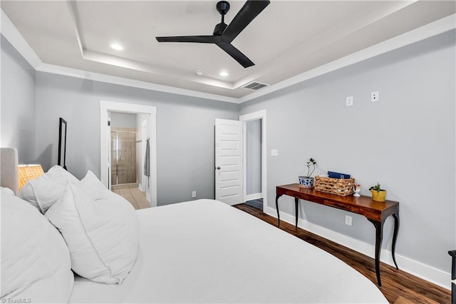 5166 Whaitley Ln, Greensboro, NC 27407 - bedroom with a tray ceiling, recessed lighting, wood finished floors, baseboards, and ensuite bathroom