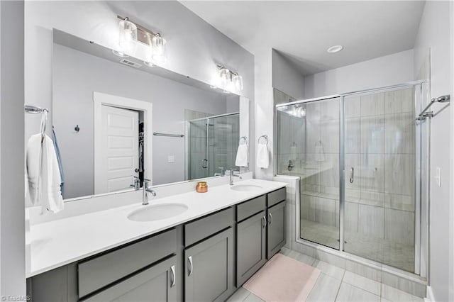 5166 Whaitley Ln, Greensboro, NC 27407 - full bath featuring a shower stall, double vanity, and tile patterned floors