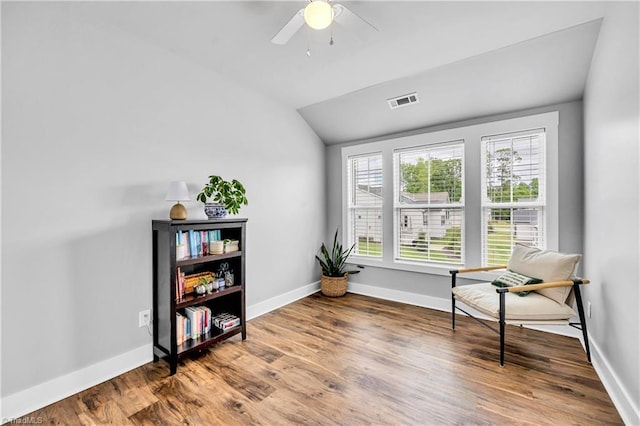 5166 Whaitley Ln, Greensboro, NC 27407 - living area with lofted ceiling, ceiling fan, baseboards, and wood finished floors
