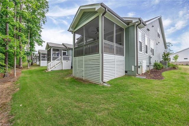 5166 Whaitley Ln, Greensboro, NC 27407 - back of property featuring a sunroom, a lawn, and crawl space