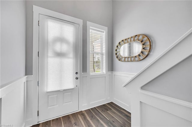 5166 Whaitley Ln, Greensboro, NC 27407 - entryway with wainscoting, dark wood-style flooring, and a decorative wall