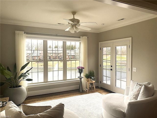 living room with visible vents, a healthy amount of sunlight, french doors, and wood finished floors