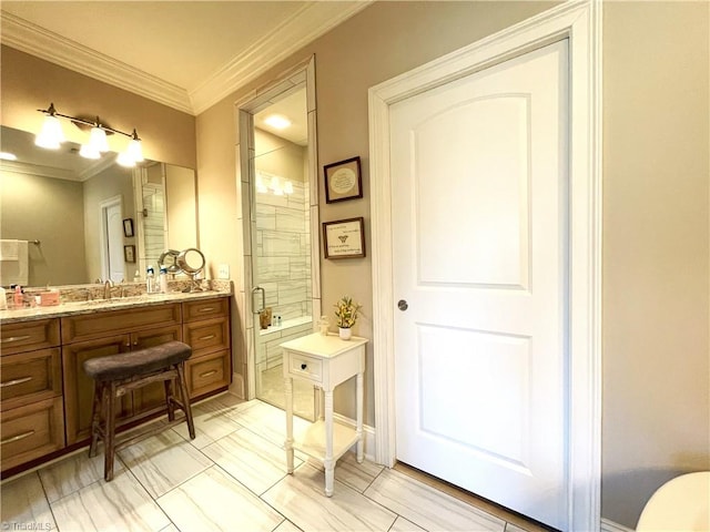 bathroom featuring vanity, a shower stall, and crown molding