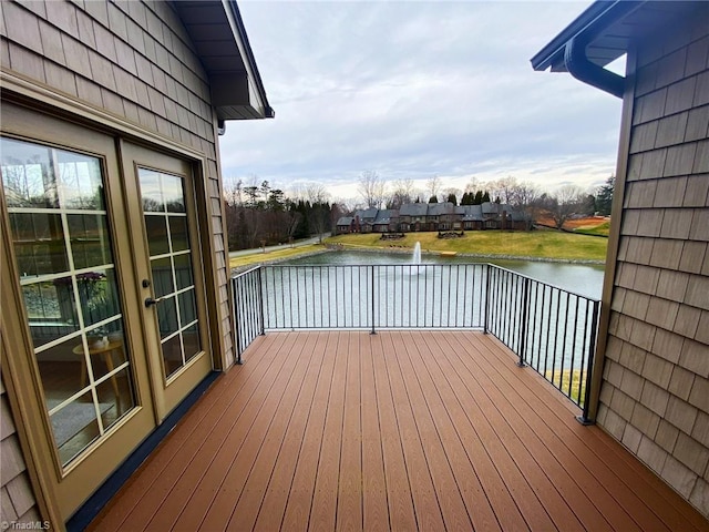 wooden deck featuring a water view