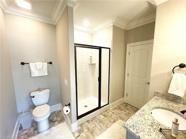 bathroom featuring a shower stall, toilet, baseboards, and ornamental molding