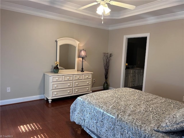 bedroom featuring a ceiling fan, baseboards, dark wood finished floors, crown molding, and connected bathroom