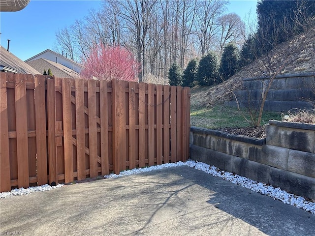 view of gate featuring fence