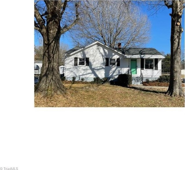 ranch-style house with a front lawn