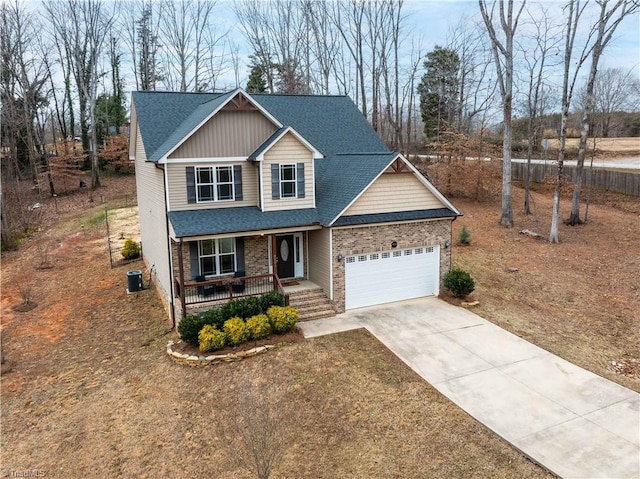 view of front of property with cooling unit and covered porch