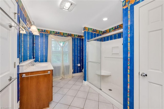 bathroom with tile patterned flooring, crown molding, a shower stall, and wallpapered walls