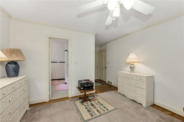 bedroom with visible vents, ornamental molding, connected bathroom, and baseboards