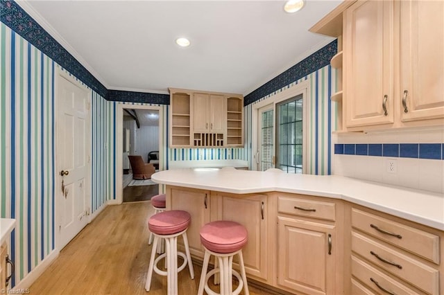 kitchen featuring crown molding, light brown cabinetry, and open shelves