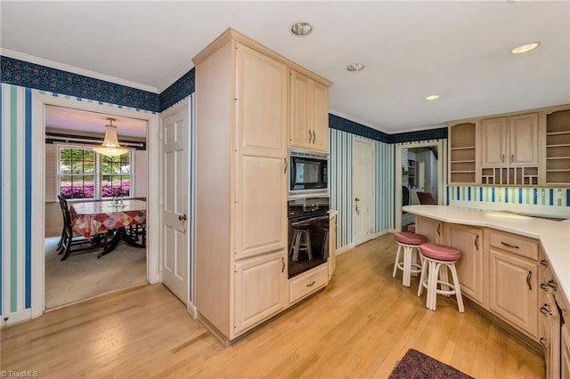 kitchen featuring ornamental molding, open shelves, black oven, wallpapered walls, and built in microwave