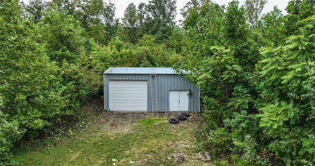 view of outdoor structure with a garage