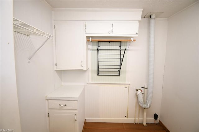 washroom featuring crown molding and hardwood / wood-style floors