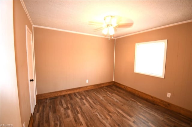 spare room with ceiling fan, ornamental molding, and dark hardwood / wood-style flooring