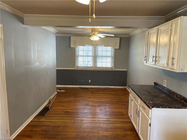157 Peace Haven Rd N, Winston-Salem, NC 27104 - unfurnished dining area featuring a ceiling fan, dark wood-style flooring, crown molding, and baseboards