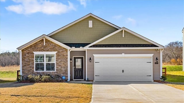 view of front facade featuring a front yard and a garage