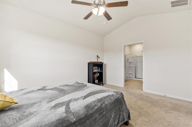 bedroom featuring a closet, light carpet, ceiling fan, a walk in closet, and lofted ceiling