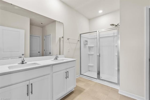 bathroom with an enclosed shower and vanity