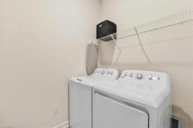 washroom featuring washing machine and dryer