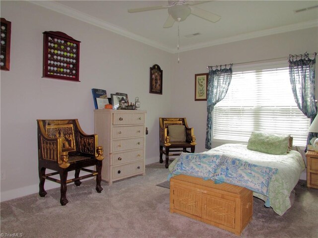 carpeted bedroom with crown molding and ceiling fan