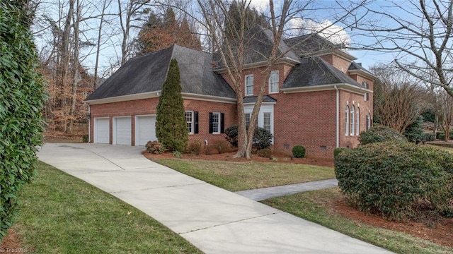 view of front of property with a garage and a front yard