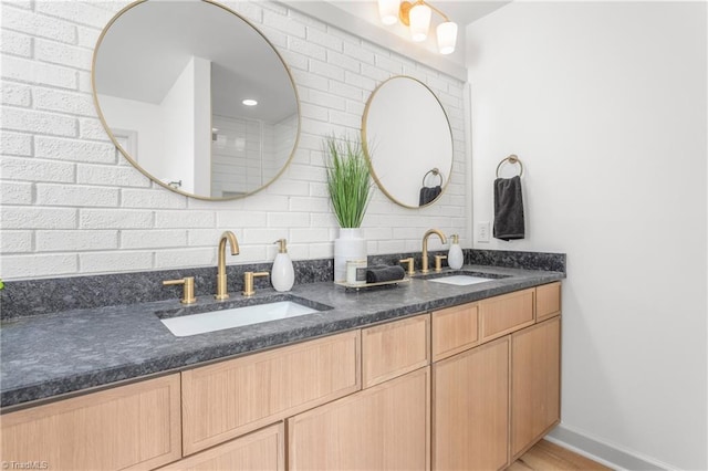 bathroom with tasteful backsplash and vanity