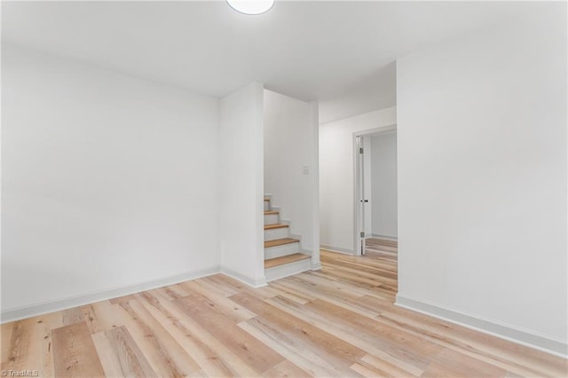 empty room with light hardwood / wood-style floors