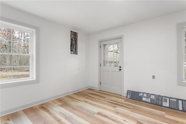 spare room featuring light wood-type flooring