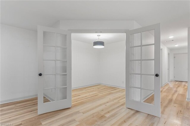 unfurnished room with wood-type flooring