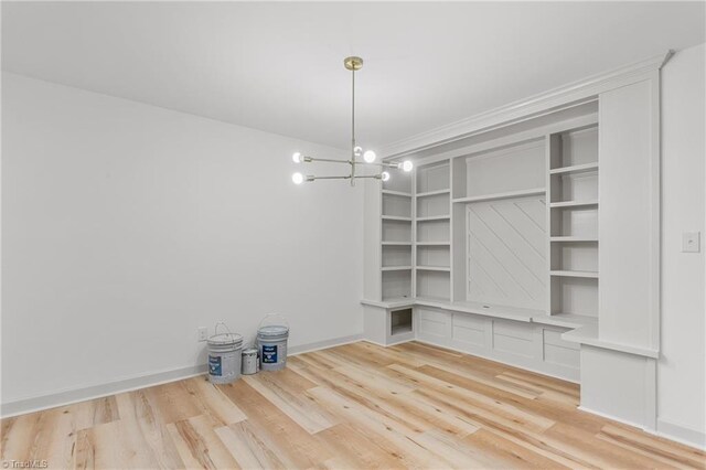 interior space featuring a chandelier and light wood-type flooring
