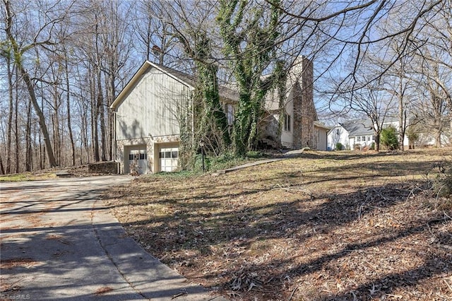 view of side of property featuring a garage