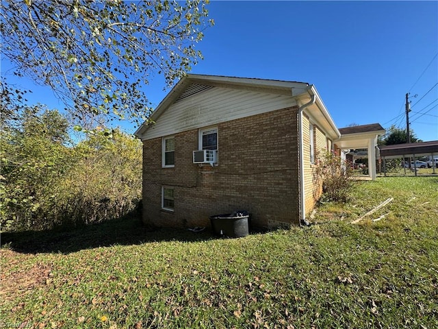 view of home's exterior with a lawn and cooling unit