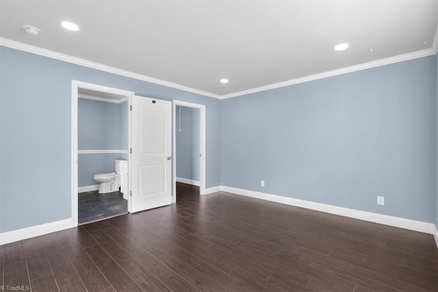 unfurnished bedroom with dark hardwood / wood-style floors, crown molding, and connected bathroom