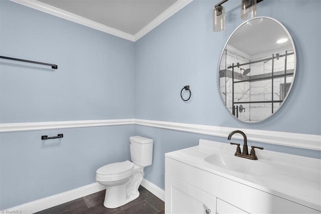 bathroom featuring walk in shower, vanity, crown molding, and toilet