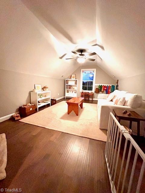 recreation room featuring lofted ceiling, hardwood / wood-style floors, and ceiling fan