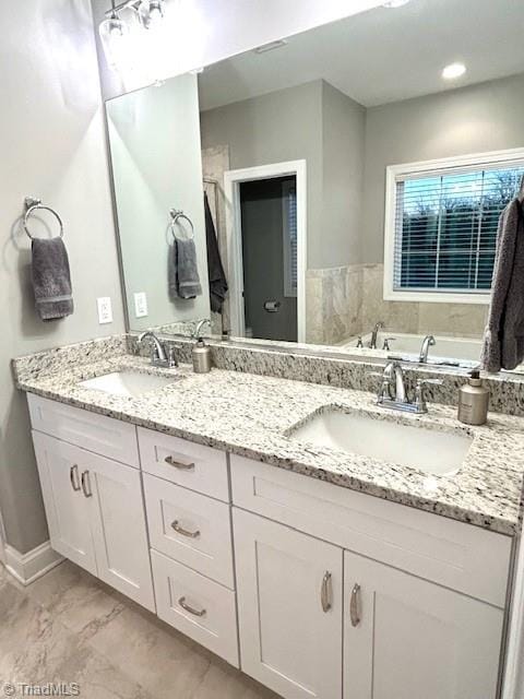 bathroom featuring vanity and a bathing tub