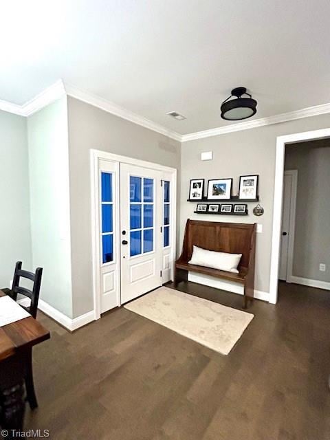 entryway with crown molding and dark hardwood / wood-style floors