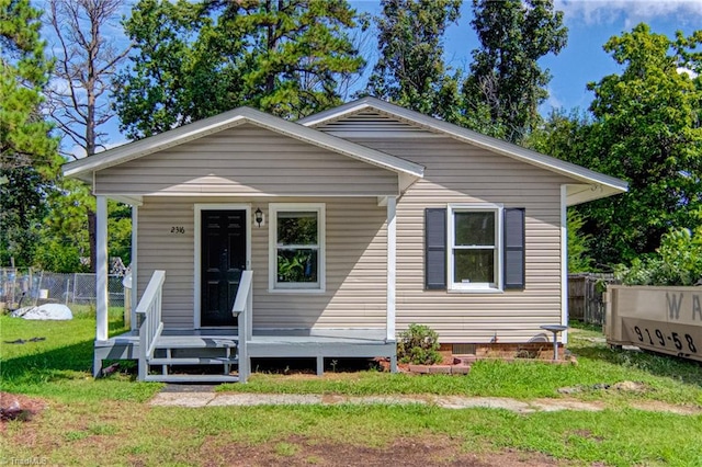 bungalow-style house with a front yard