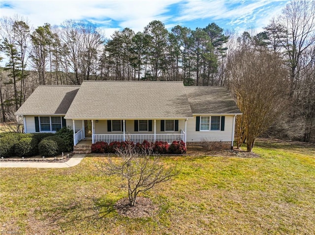 single story home featuring covered porch and a front lawn